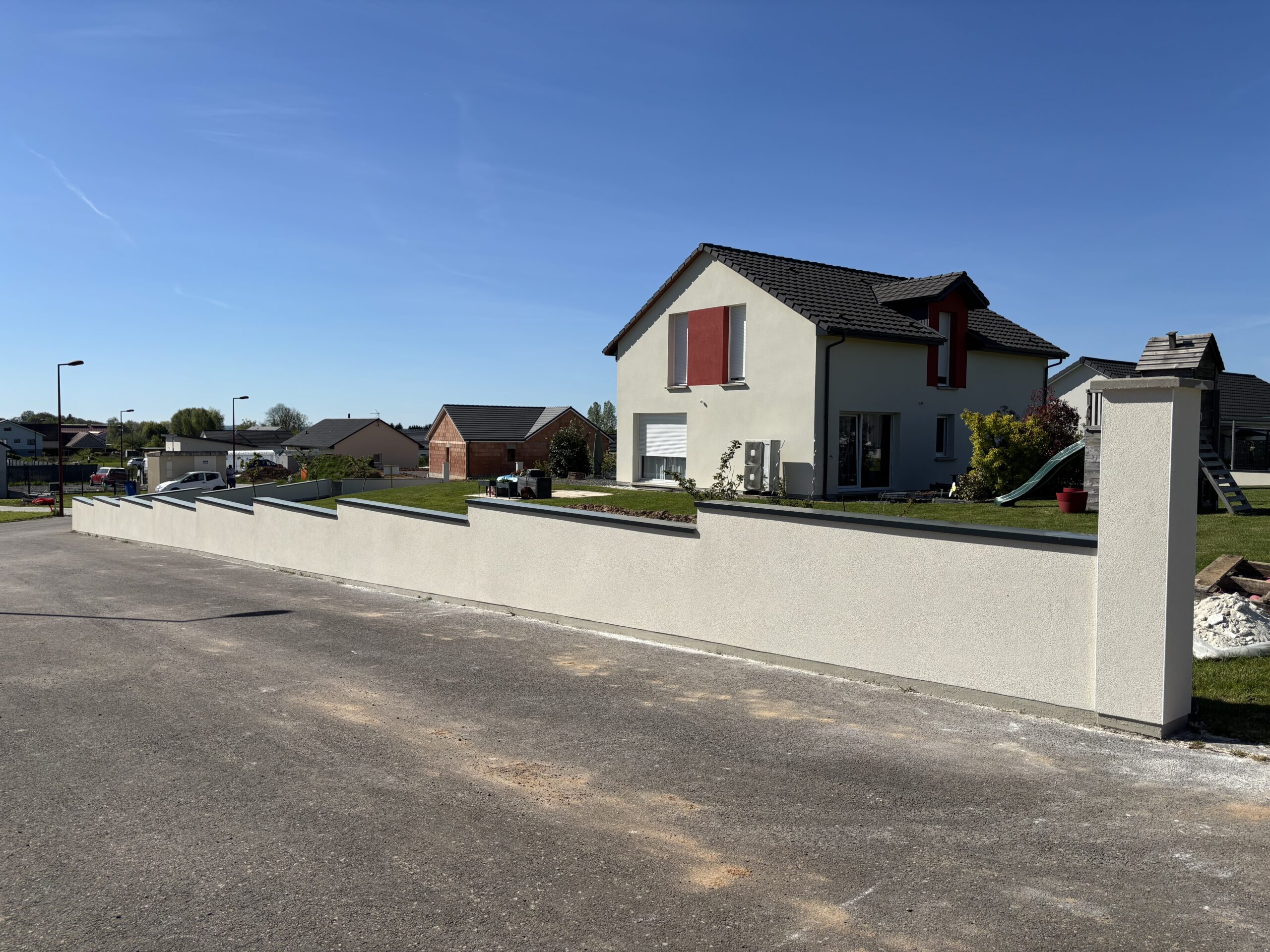 Finition murette neuve enduit extérieur maison construction Vosges